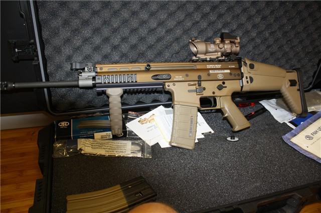 A VERY RARE FNH Scar 16s First Edition Serial 140 Rifle with Trijicon ACOG and accessories.