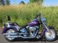 A Concord Purple, fuel injected Twin Cam Fat Boy, with just 13,353 miles!
This low mileage Fat Boy comes nicely accessorized with:
Windshield
Windshield Bag
Chrome Air Deflectors
Forward Controls
Detachable Passenger Backrest
Detachable Luggage Rack
This