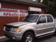 This 2004 Ford Explorer Sport Trax XLT has 4 full sized doors, a 6 cylinder engine, leather interior, & hard tonneau cover!