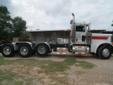 2006 Peterbilt 379 Extended hood
625 H.P.
18 Speed
White and Red Exterior with Gray Interior
4.56 Rear
265 Inch Wheel Base
Front axle 14,000 pounds, rear 46,000 pounds.
329,000 miles, excellent condition.
Loaded with electric window on right side and