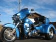 Virtually new, super-low mileage Tri-Glide Ultra Classic, with just 1,537 miles!
This stunning, locally owned Cool Blue Pearl machine comes equipped with all of the Ultra Classic's standard amenities, and is well accessorized with the following premium