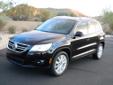 2011 Volkswagen Tiguan SEL (top of the line, the most expensive model) 2.0 T (200hp Turbo) with 6 speed Automatic, Black with Black Leather Interior, only 4,400 miles. Navigation, Push-button Start, Keyless touch open doors, Panorama Sunroof, iPod