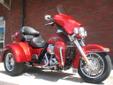 2013 Tri-Glide Ultra Classic, in a brilliant Ember Red Sunglo finish!
M.S.R.P. Â  $32,209
The Tri-Glide Ultra?s three wheeled touring platform gets you into the wind with confidence, comfort and style. This machine features exceptional handling together