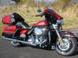New 2013 Ultra Limited, finished in a brilliant Ember Red & Merlot Sunglo.
M.S.R.P. Â  $25,239
The Ultra Limited is Harley-Davidson's top-end tourer for 2013. Milwaukee re-defines "Fully Loaded" with their long list of standard equipment, including:
Twin