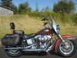 New 2013 FLSTC Heritage Softail, finished in Candy Orange & Beer Bottle.
M.S.R.P. Â  $19,524
The Heritage Softail is the benchmark for retro touring iron. A beautiful machine that comes dressed for the road and features authentic 1957 styling, a super-low