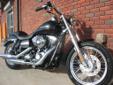 A new 2013 Dyna Superglide Custom, in Harley's timeless Vivid Black finish.
M.S.R.P. Â  $13,199
Chromed-up, polished and covered in a classic Vivid Black finish, this Superglide Custom holds true to its custom namesake. The 96 inch Twin-Cam, driving its