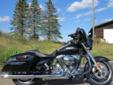 The new, redesigned 2014 Street Glide, in a timeless Vivid Black finish!
M.S.R.P. Â  $21,589
This Street Glide features Harley's Smart Security System, and these new enhancements for 2014:
High Output Twin Cam 103 Engine
Redesigned Batwing Fairing w/