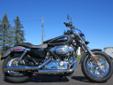 2014 Sportster 1200 Custom, in a new Charcoal Pearl & Vivid Black finish!
M.S.R.P. Â  $11,184
The 2014 Sportster 1200 Custom retains the Sportster's classic performance and agility, while maintaining the wide, beefy stature of a custom heavyweight