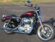 2014 Sportster 883 SuperLow, in Mysterious Red Sunglo & Blackened Cayenne Sunglo!
M.S.R.P. Â  $8,774
The Superlow's narrow ergonomic chassis delivers balanced responsive handling, in a package that puts the rider just 25.5 inches above the road.
The 4.5