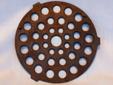 Antique Griswold cast iron trivet for skillet or dutch oven. The trivet has 3 stubby feet to hold it off the floor of the pan. It measures about 7-3/4" in diameter. It is marked as shown in the photos ? THE GRISWOLD MFG. CO. ERIE PA., U.S.A. 8 TRIVET and