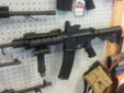 Here is a Nice Decked out Brand New DPMS, It comes with Magpul front and rear flip up sights, Quad Rail with rubber guards, Angled Rails, Front Grip with Flip out Bi-pod, 4 dot adjustable red dot scope, bump flashlight with strobe and regular flash.
