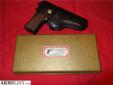 A 1972 Browning Hi Power 9mm pistol with mag, in rare excellent condition, Also a .22 Conversion kit, in the box, and a vintage Hunter leather holster. Wow. Everything is in excellent condition. Pistol appears to be fired very little and and the