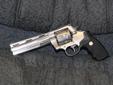 a rare Colt Anaconda 44 Magnum with Factory Ports. I was told The #"s exposed under the grips proves the factory porting. It is in great condition. Please note: All NON USPS M/O payments will be held a minimum of 7-10 Business days for bank clearing.