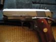 I have an Officers colt 45 Highly Blued, Checkered Walnut grips with gold colt emblem. This weapon has been shot less then 200 times and is 22 years old. It has a fluted barrel and has virtually no wear. This weapon is 98% and comes with 3 new Colt