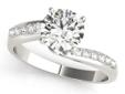 Indulge in one of the most elegantly sophisticated diamond engagement rings the industry has to offer. This masterpiece starts with a gorgeous twist shank, with twelve gorgeous round cut side stone diamonds, which converge at the round center diamond. The
