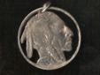 The Indian Nickel, sometimes called the Indian Head nickel or
Buffalo nickel, is so famous a coin that it probably needs no
introduction. As you can see, it makes an attractive cut coin pendant.
Get one of your own. Just click on the image or on Indian