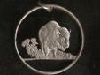 The buffalo or American bison used to roam the plains of what is now
Kansas in enormous numbers..So the Kansas state quarter. minted in 2005,
has a buffalo on its reverse side. As you can see, it makes a very
interesting cut coin pendant.
Get one for