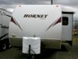 .
2010 Keystone Hornet 27BHS
Call (606) 928-6795 for pricing
Summit RV
(606) 928-6795
6611 US 60,
Ashland, KY 41102
There's plenty of room for everybody in this pre-owned Hornet travel trailer, which sleeps up to eight people. One slide gives you extra