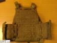 This is a military flak jacket with side plates, I took out the front and back a long time ago sorry, good deal for vest. If the pics don't upload email me
Source: