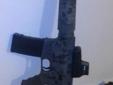 S&W M&P15 Flat top upper with A2 front sight. 4 fully loaded 30 round GI magazines. Shoots well. Duracoated Flat Dark Earth with Black skulls.
Source: http://www.armslist.com/posts/825334/topeka-kansas-rifles-for-trade--s-w-m-p15