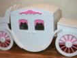 We are proud to present this exquisitely handcrafted Carriage Toy Box Hope Chest, shown here in a beautiful shade of bright white with stunning pink accents. This Toy Box Hope Chest is completely handcrafted by highly skilled artisans from start to