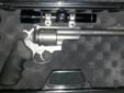 Excellent condition Super redhawk in 454 casull and will also fire 45 colt. 7 1/2" barrel. Comes with factory rings and a mounted Leupold M8 2x scope. VERY accurate gun and the recoil isnt bad. Brand new set of Hogue grips installed. It will also come