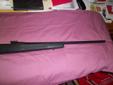 This is a Savage 111 in 30-06. It has a stainless steel bolt, the rest of the metal is blued. It has a black graphite and fiberglass stock. The internal magazine holds four rounds. It has a 22" barrel. The Weaver scope base is NOT drilled at tapped but is