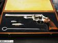 Smith & Wesson Model 29-2 revolver, .44 Magnum cal., 8-3/8? barrel, nickel finish, combat checkered medallion wood grips. This gun is in overall excellent condition showing approx. 99% originalfactory nickel finish, fine bore, crisp action, sharp