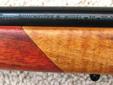 Winchester post '64 model 70 rifle, push feed, .30-06 caliber, walnut thumbhole right hand stock w/rosewood forend tip and grip cap, Devcon and pillar bedded, Pachmayer white line recoil pad, 21? length barrel, length of pull 13-1/2?, drilled & tapped for