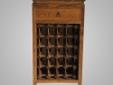 This is the perfect wine cabinet for any wine connoisseur. This beautiful wine cabinet with its natural wood finish holds up to 20 of your favorite bottles, alongside with its top drawer to store any wine gadgets to accommodate, compliment, and satisfy